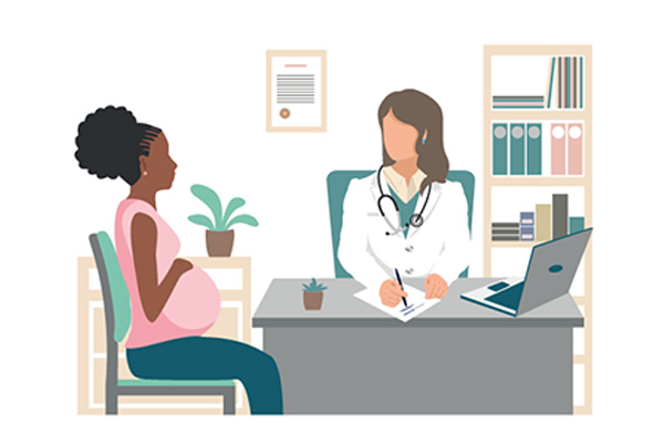 Pregnant woman sat with a doctor